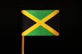 A official and original Flag of Jamaica on toothpick and on black background. Jamaica located in the central america. Royalty Free Stock Photo