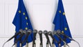 Official press conference. Flags of the European Union EU and microphones. Conceptual 3D rendering Royalty Free Stock Photo