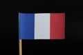 A official and simple flag of France on toothpick on black background. Consists of A vertical tricolour of blue, white, and red Royalty Free Stock Photo