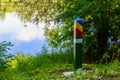 Official warning pole about the border zone of the Republic of Moldova with the state emblem on the plate. Background