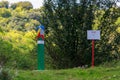 Official warning pole about the border zone of the Republic of Moldova with the state emblem on the plate. Background