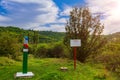 Official warning pole about the border zone of the Republic of Moldova with the state emblem on the plate. Background