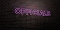 OFFICIALS -Realistic Neon Sign on Brick Wall background - 3D rendered royalty free stock image