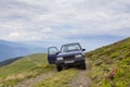 Driving a 4x4 car on a mountain road Royalty Free Stock Photo