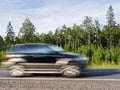 Offroad car on country highway, motion blur