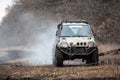 Off road car is driving on a bad dirty road Royalty Free Stock Photo