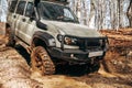 Offroad car driving through the forest road of mud Royalty Free Stock Photo