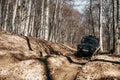 Offroad car driving through the forest road of mud Royalty Free Stock Photo