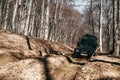 Offroad car driving through the forest road of mud Royalty Free Stock Photo