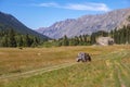 Offroad car is riding on gravel road. Overlanding concept. Kora river gorge in Kazakhstan, way to Burkhan bulak waterfall. Royalty Free Stock Photo