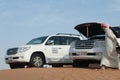 Offroad cars on dunes in Dubai desert