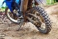 Offroad mountain motorcycle or bike taking part in motocros competition parked on dirty terrain road