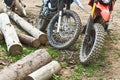 Offroad mountain motorcycles or bikes taking part in motocros competition parked on dirty terrain road