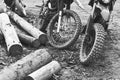 Offroad mountain motorcycles or bikes taking part in motocros competition parked on dirty terrain road