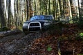 Offroad race on fall nature background Motor racing in autumn forest. Rallying, competition and four wheel drive concept Royalty Free Stock Photo