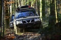 Offroad race on fall nature background. Rallying, competition and four wheel drive concept. Sport utility vehicle or SUV