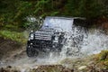 Offroad race in forest. Car racing with creek on way. Extreme driving, challenge and 4x4 vehicle concept. SUV or offroad Royalty Free Stock Photo