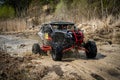 Offroad vehicle in the action and makes splashes of dirty water Royalty Free Stock Photo