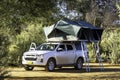 Offroad vehicle, car, camping with tents on its roof in bush Africa