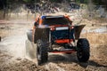 Offroad vehicle makes splashes of dirty water at sunny day Royalty Free Stock Photo