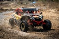 Offroad vehicle makes splashes of dirty water at sunny day Royalty Free Stock Photo