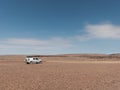 Offroad vehicle in stone desert