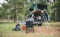 Offroad 4x4 vehicle with tent in roof ready for camping Royalty Free Stock Photo