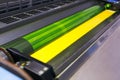 Offset printing machine - yellow ink Royalty Free Stock Photo