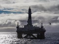 Offshore drilling rig in Gulf of Mexico, petroleum industry, with helicopter