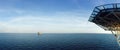 Panorama of offshore drilling rig with supply boat