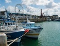 Offshore fishing boats in the commercial harbor and port of Granville on the Normandy coast Royalty Free Stock Photo