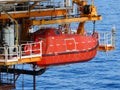 Offshore Life boat or survival craft at muster station of oil and gas drilling rig