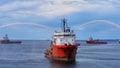 An offshore marine vessel doing FiFi testing or fire fighting training. Royalty Free Stock Photo