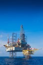 Offshore oil and gas drilling rig working on wellhead platform Royalty Free Stock Photo