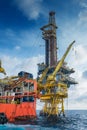 Offshore oil and gas production and exploration, tender rig work over remote platform. Royalty Free Stock Photo