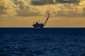 Offshore oil and rig platform in the sunset or sunrise time. Royalty Free Stock Photo