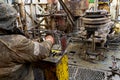 Offshore oil rig worker prepare tool and equipment for perforation oil and gas well at wellhead platform. Making up a drill pipe