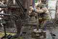 Offshore oil rig worker prepare tool and equipment for perforation oil and gas well at wellhead platform. Making up a drill pipe