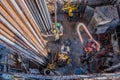 Offshore oil rig worker prepare tool and equipment for perforation oil and gas well at wellhead platform. Making up a drill pipe Royalty Free Stock Photo