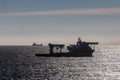 Offshore Subsea Construction vessel Olympic Ares at anchor in silhouette