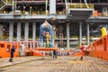 Offshore platform pedestal crane lifting a personal basket transfer