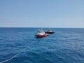 Offshore Tugboat Pulling Rope at Sea