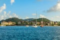 Offshore view of Rodney bay with yachts anchored in the lagoon and rich resorts in the background, Saint Lucia, Caribbean sea