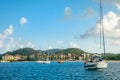 Offshore view of Rodney bay with yachts anchored in the lagoon and rich resorts in the background, Saint Lucia, Caribbean sea