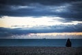 Offshore wind farm at dusk viewed from the beach Royalty Free Stock Photo