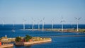 Offshore wind farm with Trekroner Fort in foreground in the Baltic Sea off the coast of Denmark Royalty Free Stock Photo