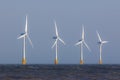 Offshore wind farm turbines on sea horizon. Renewable clean ener