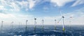 Offshore wind power and energy farm with many wind turbines on the ocean Royalty Free Stock Photo