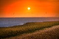 Offshore Wind Turbine in a Wind farm under construction off the England coast at sunset Royalty Free Stock Photo