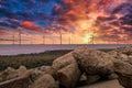 Offshore Wind Turbine in a Wind farm under construction off the England coast at sunset Royalty Free Stock Photo